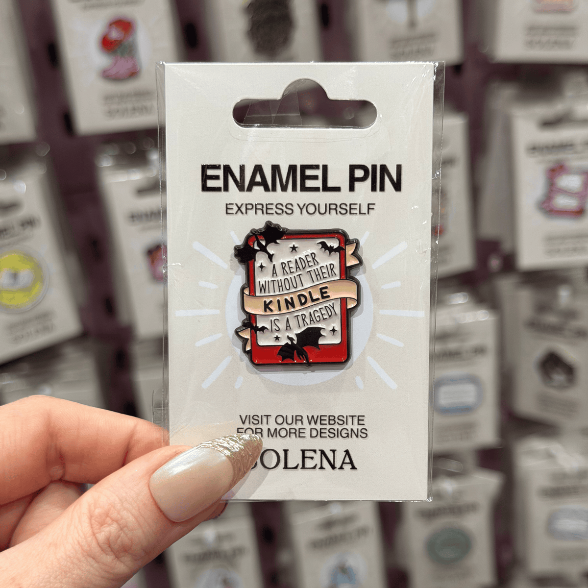 A READER WITHOUT THEIR KINDLE IS A TRAGEDY PIN